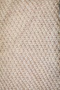 Background texture of beige pattern knitted fabric made of cotton or wool top view Royalty Free Stock Photo