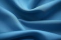 background of the texture of blue nylon textile fabric laid in soft folds close-up,wallpaper concept,the basis for the banner Royalty Free Stock Photo