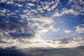 Background and texture of bright blue sky and cotton clouds with sun lights on afternoon summer Royalty Free Stock Photo
