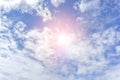 Background and texture of bright blue sky and cotton clouds with sun lights on afternoon summer Royalty Free Stock Photo