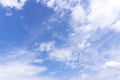 Background and texture of bright blue sky and cotton clouds with sun lights on afternoon summer Royalty Free Stock Photo
