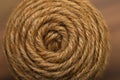 Background of the texture of a circle of a coil of natural hemp rope.