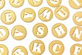 background and texture circles of golden textured paper in the form of coins and letters cut out of them. Royalty Free Stock Photo