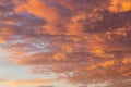 Background with the texture of clouds at sunset. Heavenly landscape. Beautiful morning sky painted in bright red and orange colors Royalty Free Stock Photo