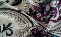 Background texture. cotton women scarf black and white pattern on one side of the scarf and color paisley pattern on the other