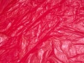 background texture of crumpled red plastic Royalty Free Stock Photo