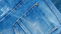Background texture of denim fabric with pockets and stitched seams with buttons and rivets from different pieces of jeans