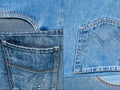 Background texture of denim fabric with pockets and stitched seams with buttons and rivets from different pieces of jeans