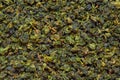 Background texture of dry green Tie Guan Yin Oolong tea Royalty Free Stock Photo
