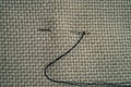 Background texture fabric canvas with needle and thread Royalty Free Stock Photo