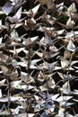 Background texture of folded origami paper cranes made from vintage papers