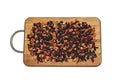 Background texture fragrant dry black tea with fruits and petals. Isolate on a wooden board. Tea with a predominance of dry Royalty Free Stock Photo