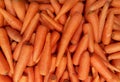 Background texture of fresh large carrots vegetables in supermarket