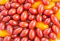 Background texture - jumble of red and orange grape tomatoes
