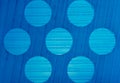 Background texture gradations and circle pattern on blue plastic