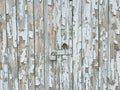 Background texture gray broken paint on old garage wooden door with a lock Royalty Free Stock Photo