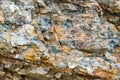 Background texture of a gray brown stone on the rock of the mountain discovered during archaeological excavations as a monument t Royalty Free Stock Photo
