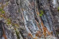 Background texture of a gray brown stone on the rock of the mountain discovered during archaeological excavations as a monument to Royalty Free Stock Photo