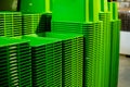 Background texture of green plastic buckets.A stack of recycled plastic buckets on display at a sundry store.bowls on