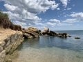 Background texture: large stones of various shapes in the sea. A pile of granite boulders against the background of the sea and Royalty Free Stock Photo