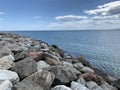 Background texture: large stones of various shapes in the sea. A pile of granite boulders against the background of the sea and