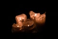 Large white burning candles in dark room over wall background Royalty Free Stock Photo