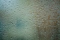 Background or texture. It is a lot of small a rain drops on window glass. Rainy day of spring. Royalty Free Stock Photo