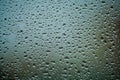 Background or texture. It is a lot of small a rain drops on window glass. Rainy day of spring. Royalty Free Stock Photo