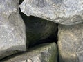 Background texture: many large stones of different shapes. A pile of granite boulders. Concept - stone, hardness, foundation