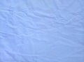 Background texture of matted sea blue fabric