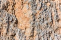 Background and texture of mountain layers and cracks in sedimentary rock on cliff face. Cliff of rock mountain. Royalty Free Stock Photo