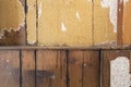 Background texture of a old destroyed wall with vintage torn wallpaper and old wood, abandoned house Royalty Free Stock Photo