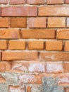 Background texture old red weathered brick wall with damage and white light spots Royalty Free Stock Photo