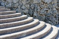 Background texture, old Stone wall and concrete semicircular stairs Royalty Free Stock Photo