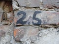 Background texture of old wall. with numbers 2 and 5, two, five, two and a half Royalty Free Stock Photo