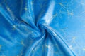 Background texture, pattern. Fabric blue silk with gold pattern. Royalty Free Stock Photo