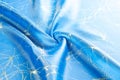Background texture, pattern. Fabric blue silk with gold pattern. Royalty Free Stock Photo
