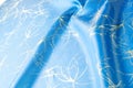 Background texture, pattern. Fabric blue silk with gold pattern. Royalty Free Stock Photo