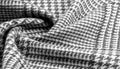 Background texture, pattern. The fabric is thick, warm with a checkered pattern, gray black. This is an unforgettable encounter Royalty Free Stock Photo