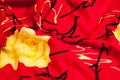 Background texture, pattern. Red silk fabric Yellow roses. Print Royalty Free Stock Photo