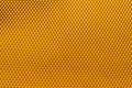 Background texture and pattern of a section of wax honeycomb from a bee hive filled without golden honey in a full frame view, Royalty Free Stock Photo