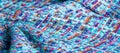 Background texture, pattern. Winter fabric, warm. big braided thread. Blue-red yellow threads. This photo will make your design