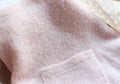 Background texture of pink pattern knitted fabric made of angora or wool. close up Royalty Free Stock Photo