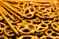 Background texture of salted salty pretzels and mini sticks in the traditional form of the hinge assembly Royalty Free Stock Photo