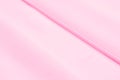 Background texture template. silk fabric is dense, pink. Teanting with texture, Shantung has a satisfactorily nubby arm paired wi Royalty Free Stock Photo