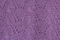 Background texture of violet pattern knitted fabric made of cotton or wool closeup