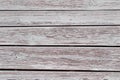 The background is the texture of a wall of large planks painted with white paint which peeled from time to time in pastel colors Royalty Free Stock Photo