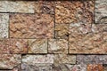 Background, texture of a wall made of large stone blocks. A wall of blocks of different sizes. Royalty Free Stock Photo