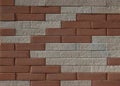 Background and texture. Wall with randomly placed red and white bricks. Royalty Free Stock Photo