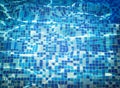 Background texture of water with mosaic bottom caustics ripple in swimming pool. Shining sun reflection, motion of wave. Summer. Royalty Free Stock Photo